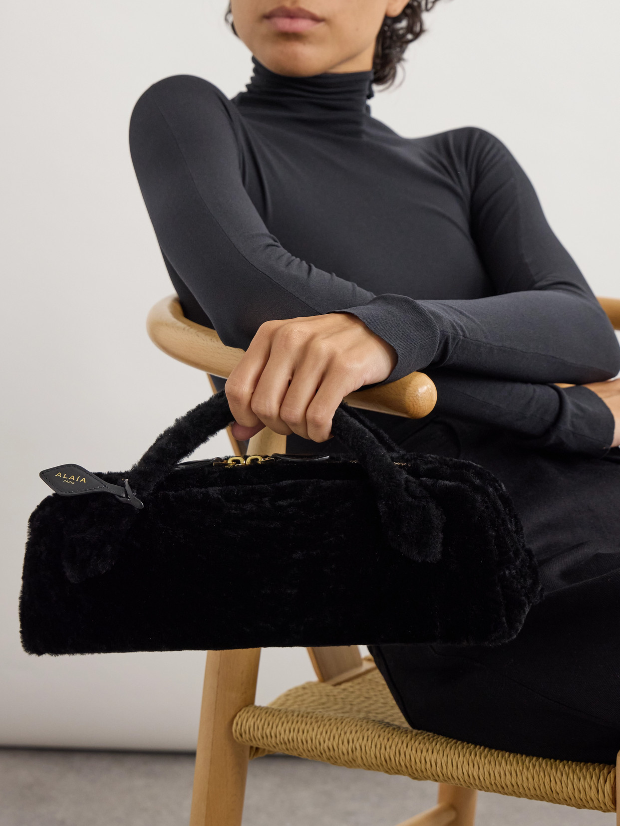 Alaïa Le Teckel Leather-trimmed Shearling Clutch In Black