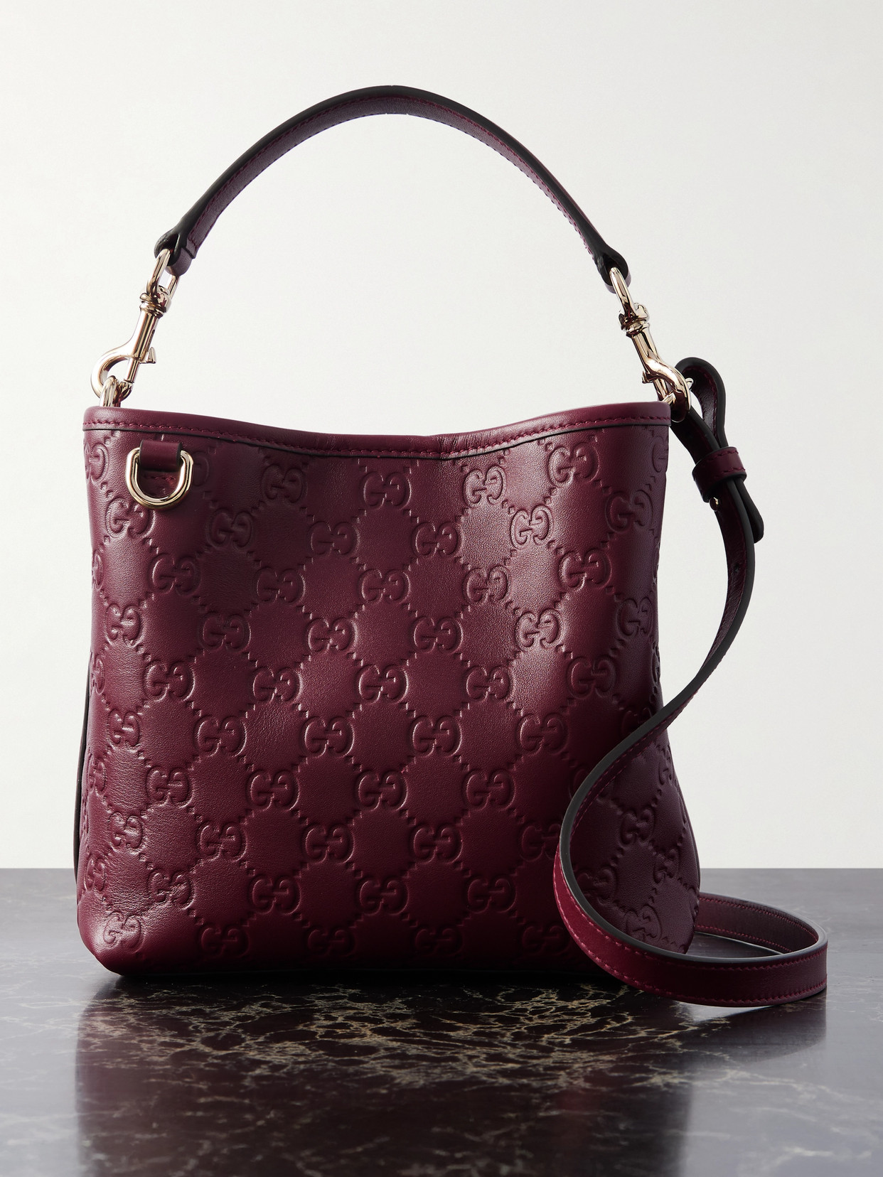 Gucci Gg Emblem Debossed Leather Tote In Burgundy