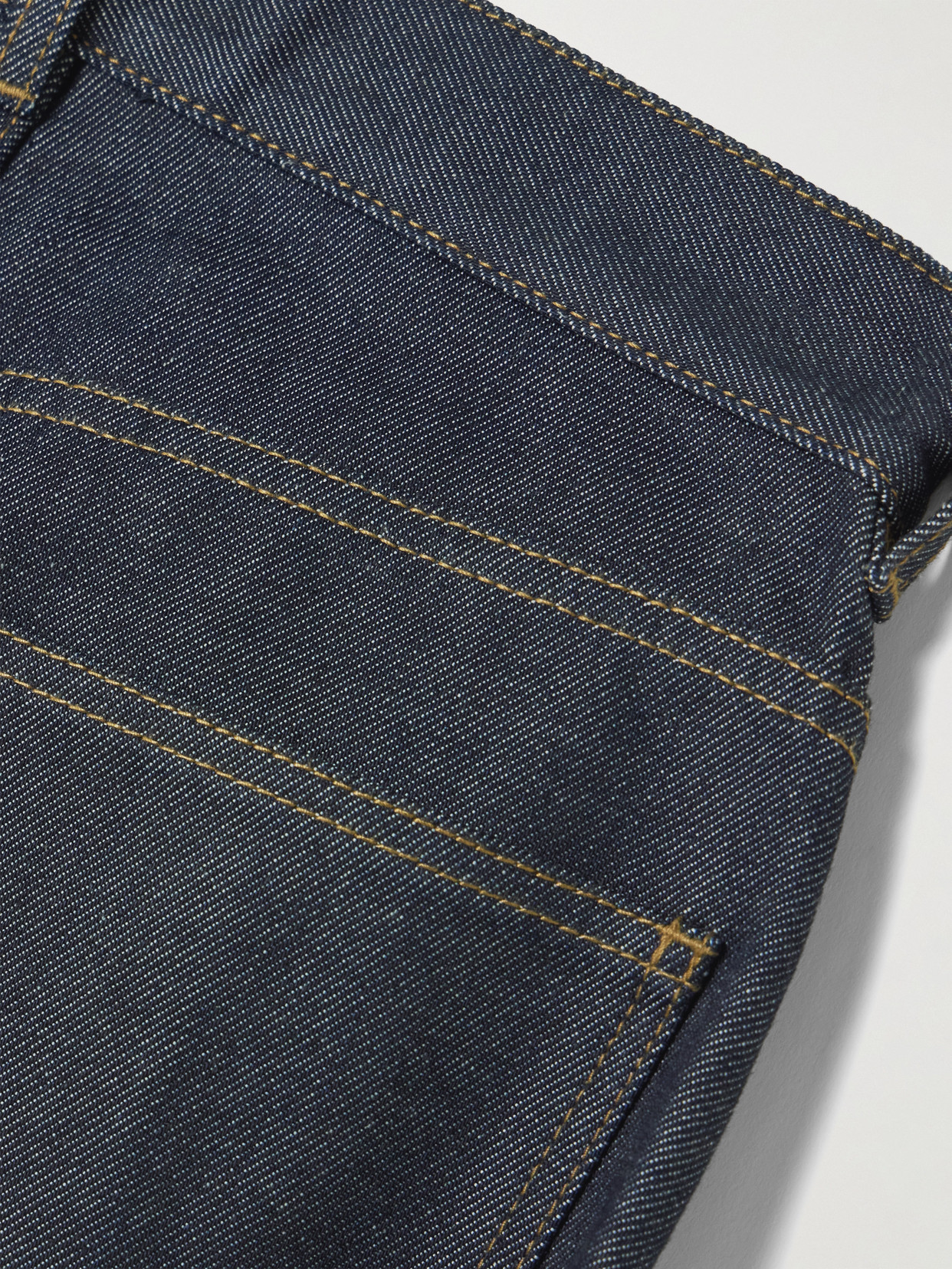 Jw Anderson Twisted Asymmetric Embroidered High-rise Jeans In Blue