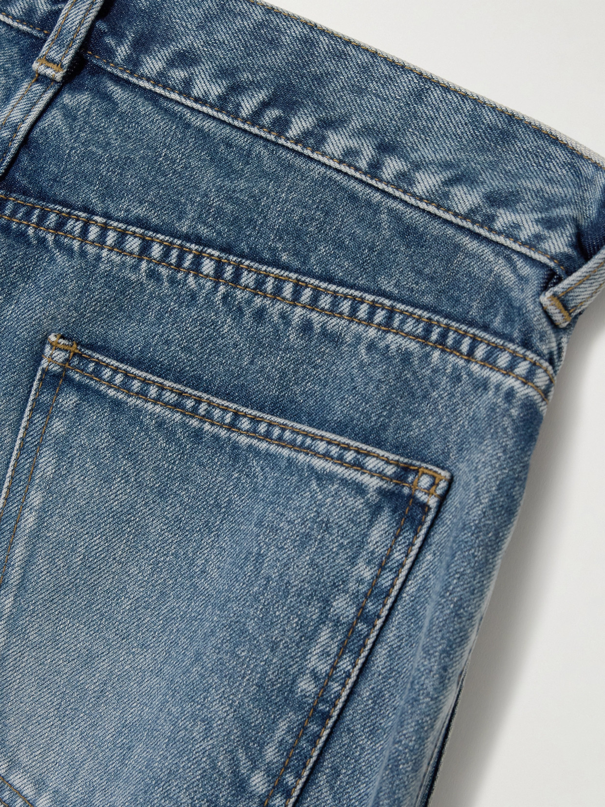 Jw Anderson Twisted Asymmetric Embroidered High-rise Jeans In Blue