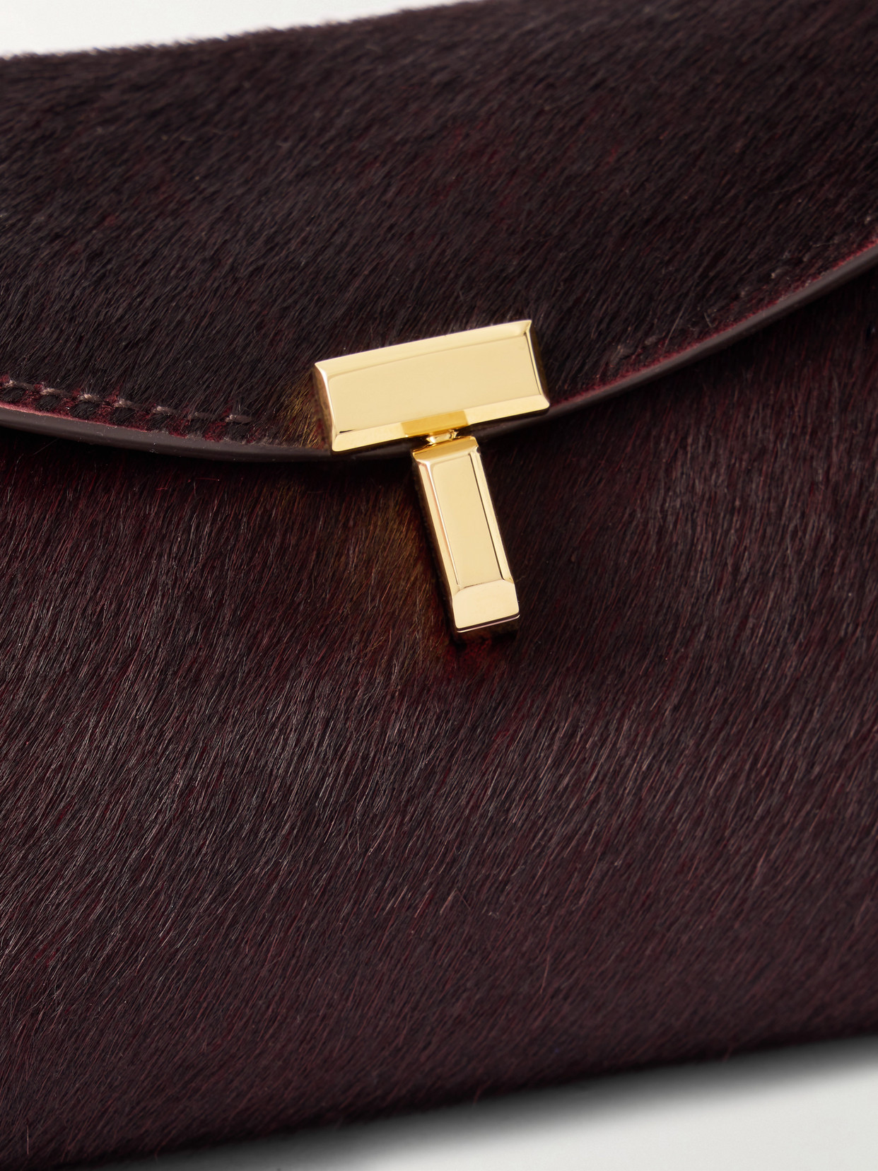 Totême T-lock Mini Calf Hair Clutch In Brown