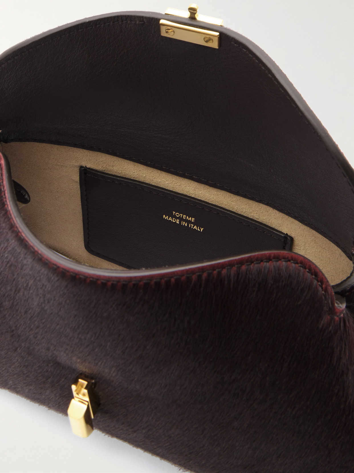 Totême T-lock Mini Calf Hair Clutch In Brown