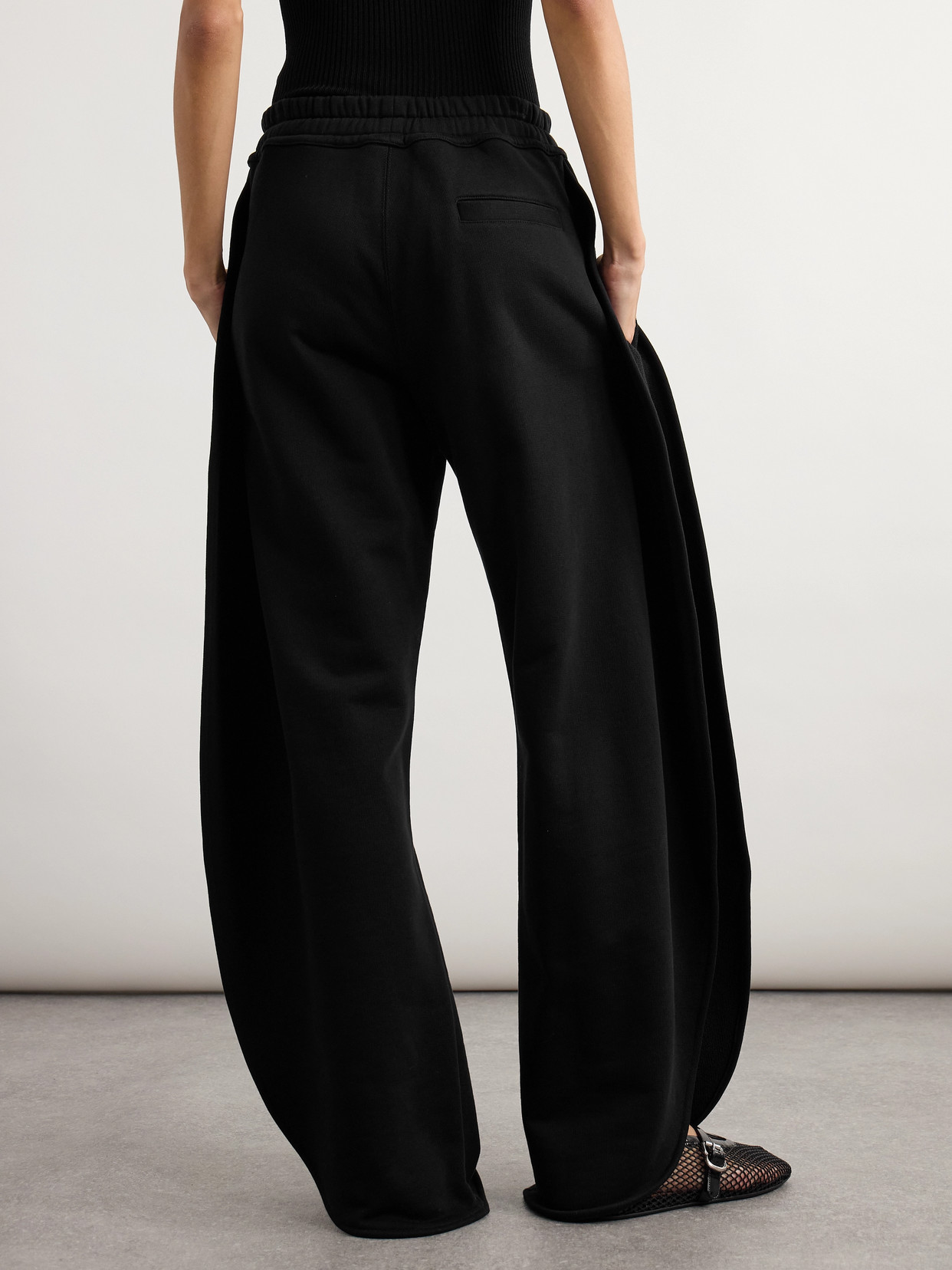 Alaïa Petal Cotton-jersey Barrel-leg Track Pants In Black