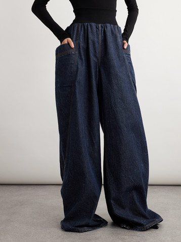 Alaïa Jersey-trimmed high-rise wide-leg jeans