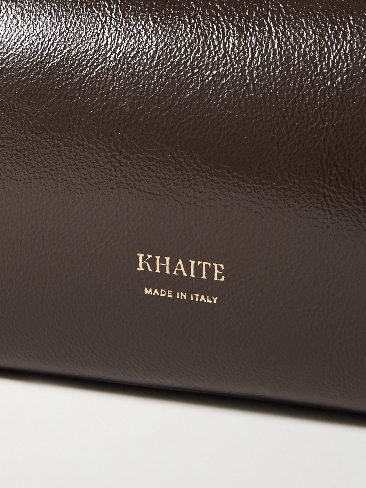 Khaite Kye Glossed-leather Shoulder Bag In Brown