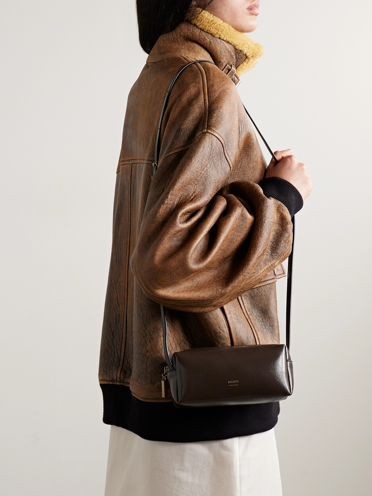 Khaite Kye Glossed-leather Shoulder Bag In Brown