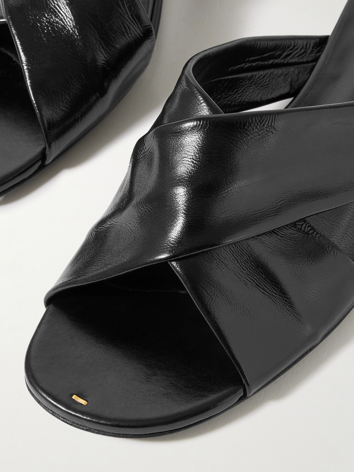 Khaite Liria Glossed-leather Sandals In Black