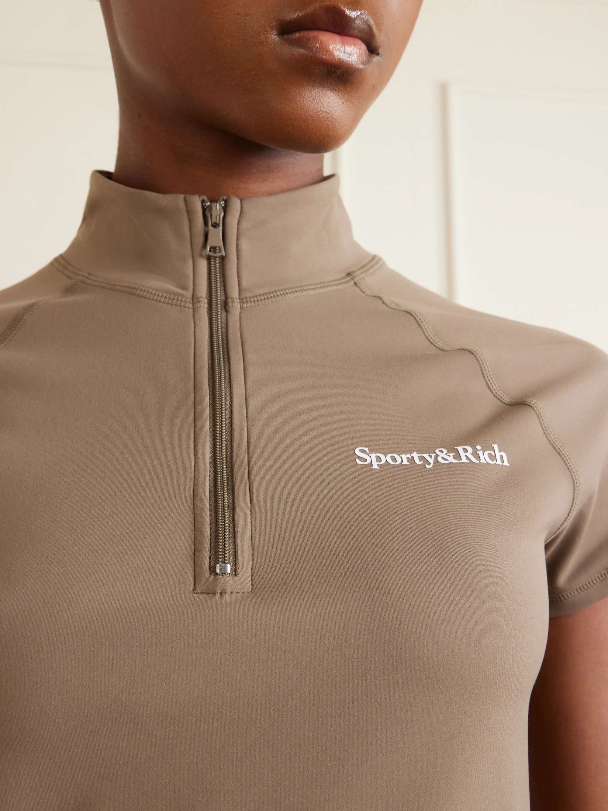 SPORTY & RICH Logo-print stretch-jersey half-zip T-shirt | NET-A