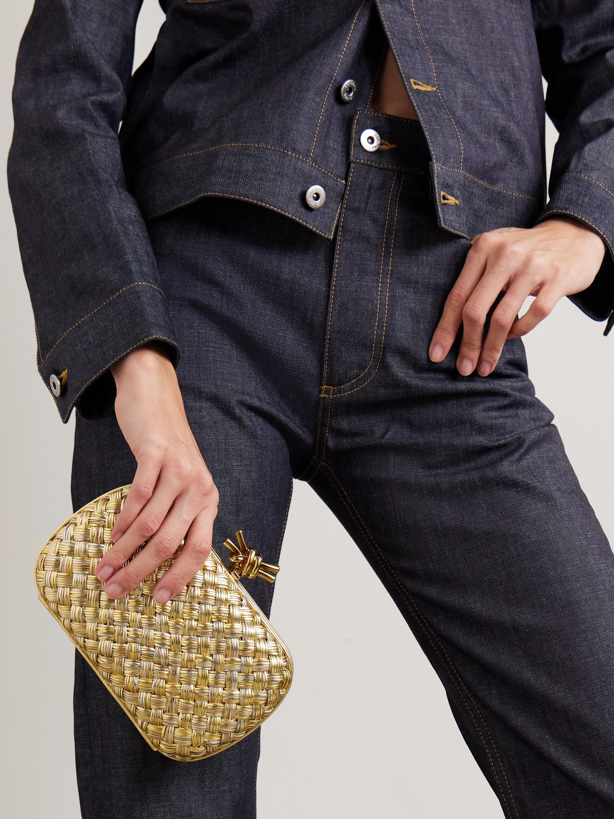 Bottega Veneta Knot Intrecciato Metallic Leather Clutch In Gold