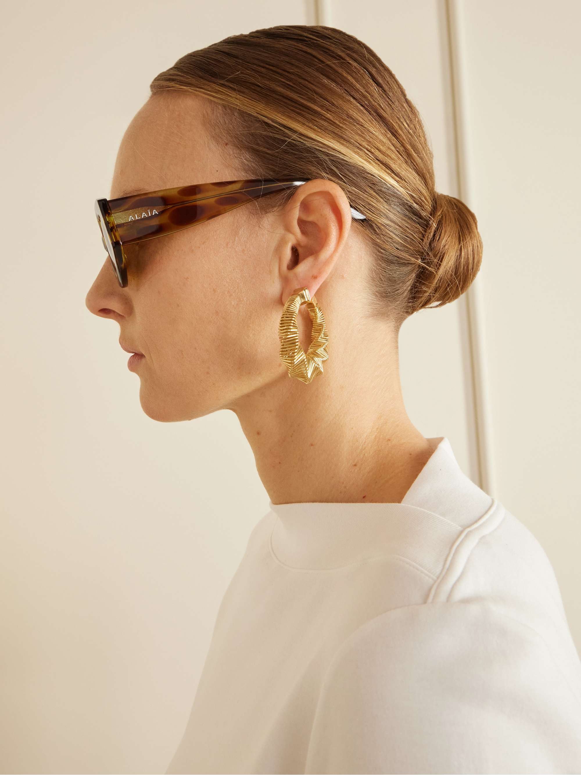 ALAÏA EYEWEAR Lettering round-frame tortoiseshell acetate