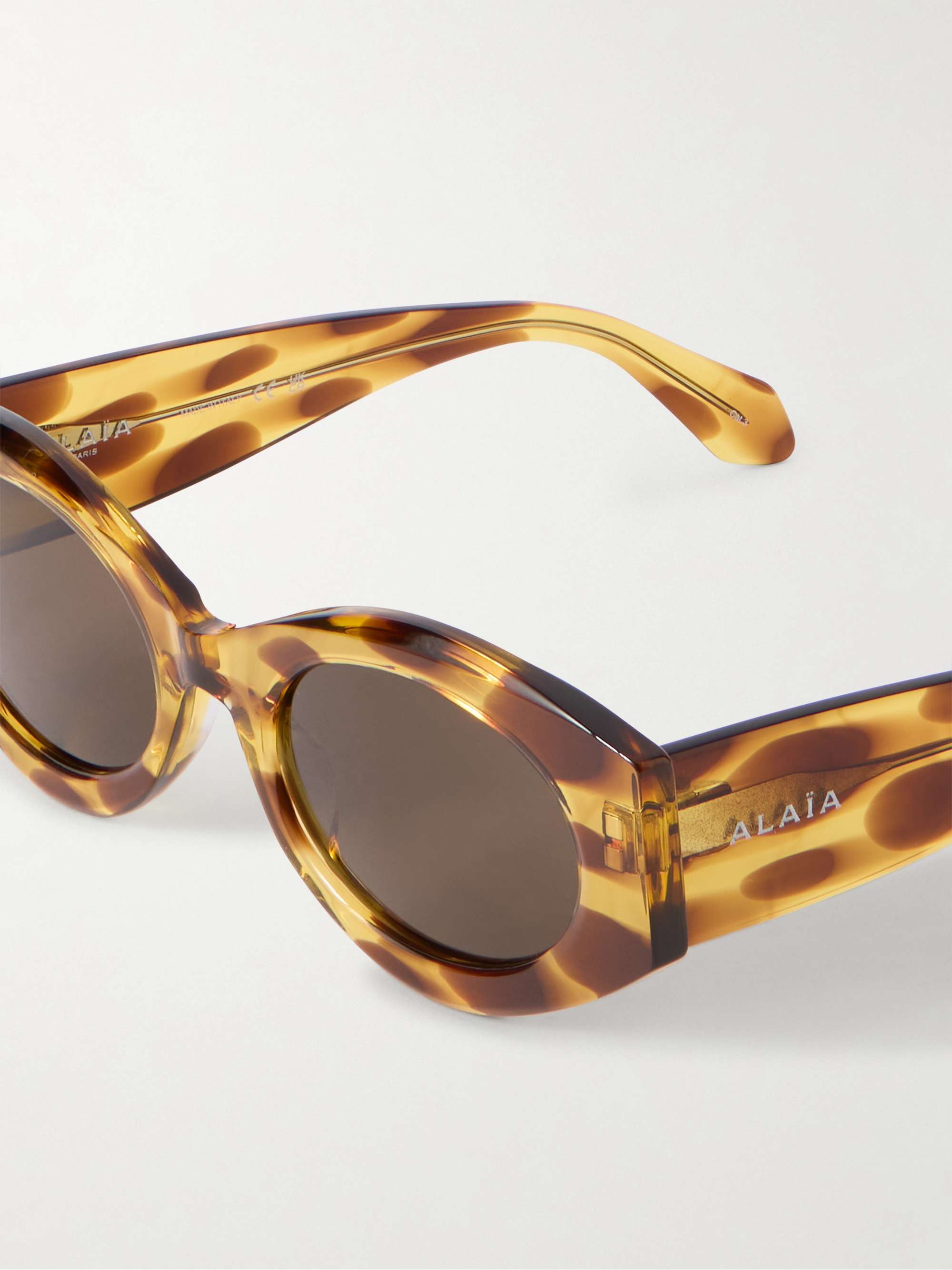 ALAÏA EYEWEAR Lettering round-frame tortoiseshell acetate