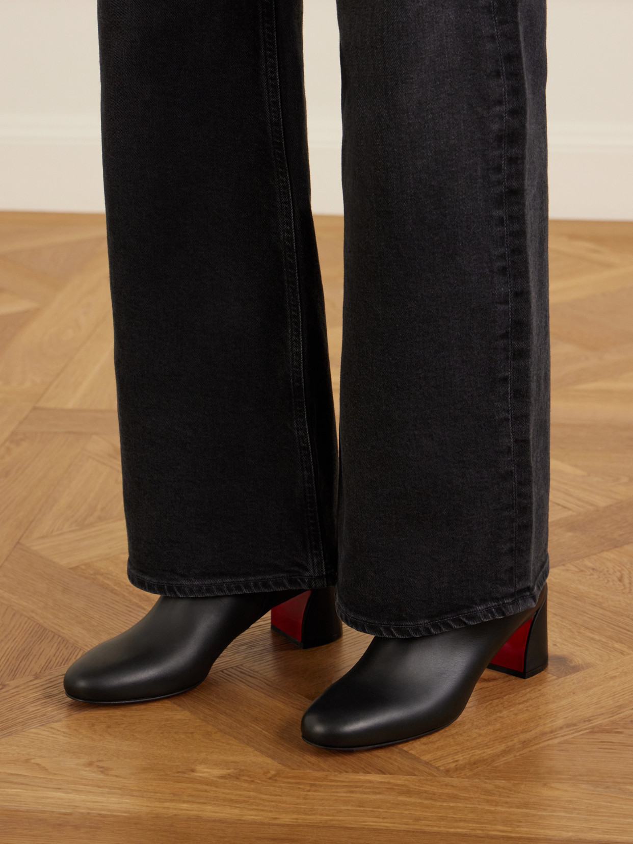 Christian Louboutin Turela Leather Side-zip Red Sole Booties In Black