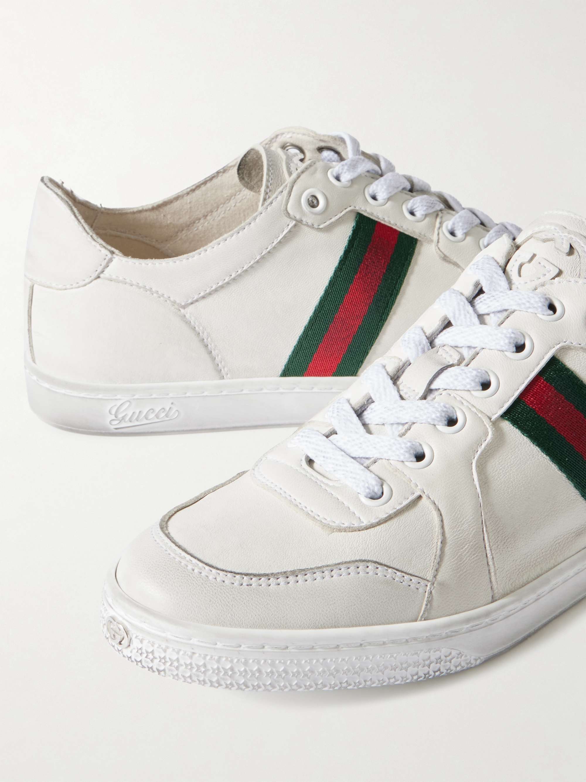GUCCI Stretch distressed webbing-trimmed leather sneakers | NET-A