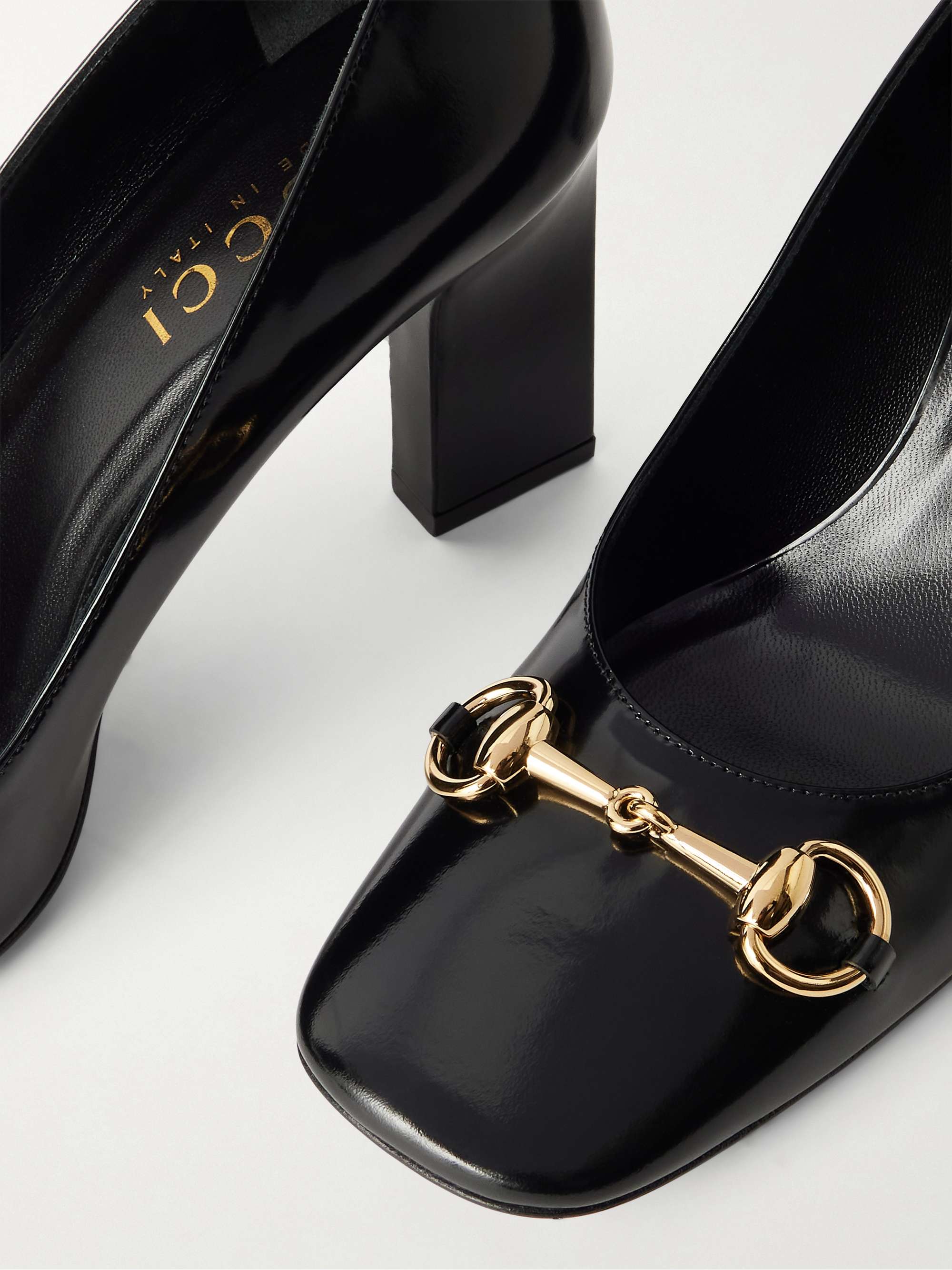 GUCCI Signora horsebit-embellished glossed leather pumps | NET-A