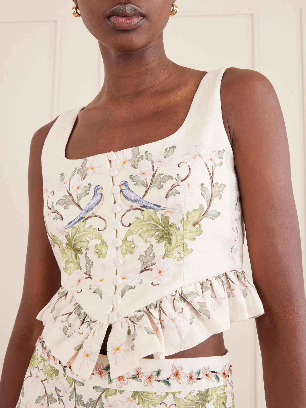 Eslabon Anhelo Floral-Print Button-Embellished Linen Cropped Top