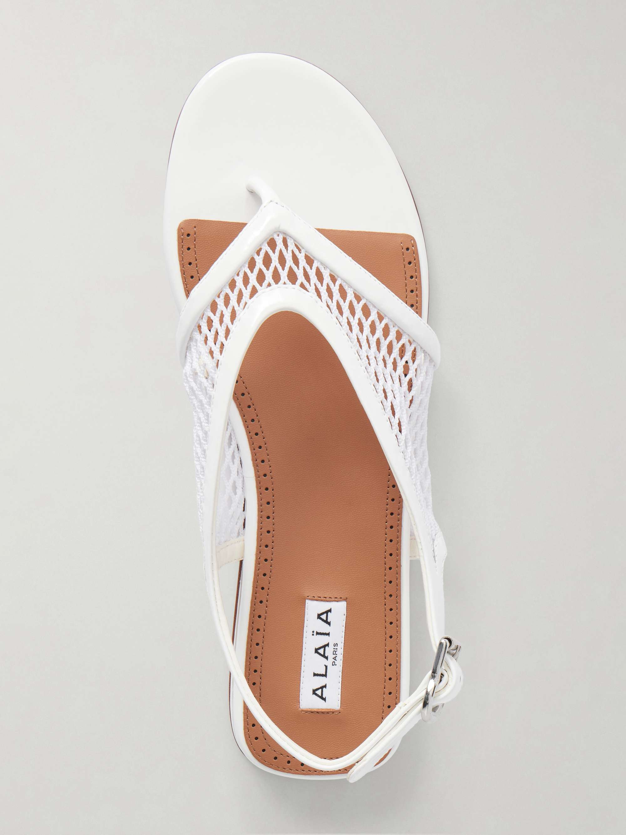 ALAÏA Fishnet flat sandals | NET-A-PORTER
