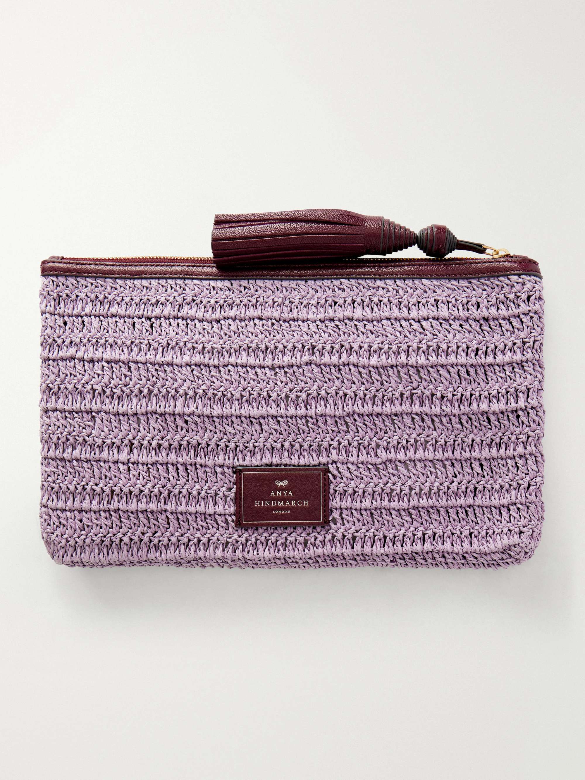 ANYA HINDMARCH Wink tasseled leather-trimmed raffia clutch bag