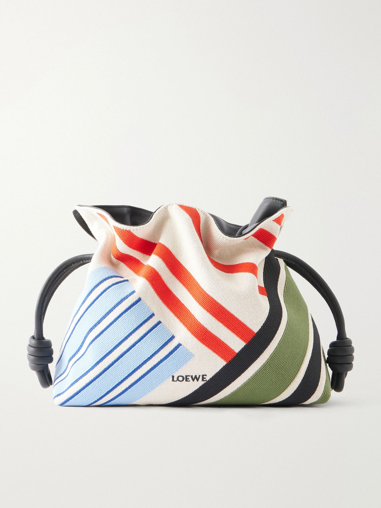 flamenco leather trimmed paneled striped canvas clutch