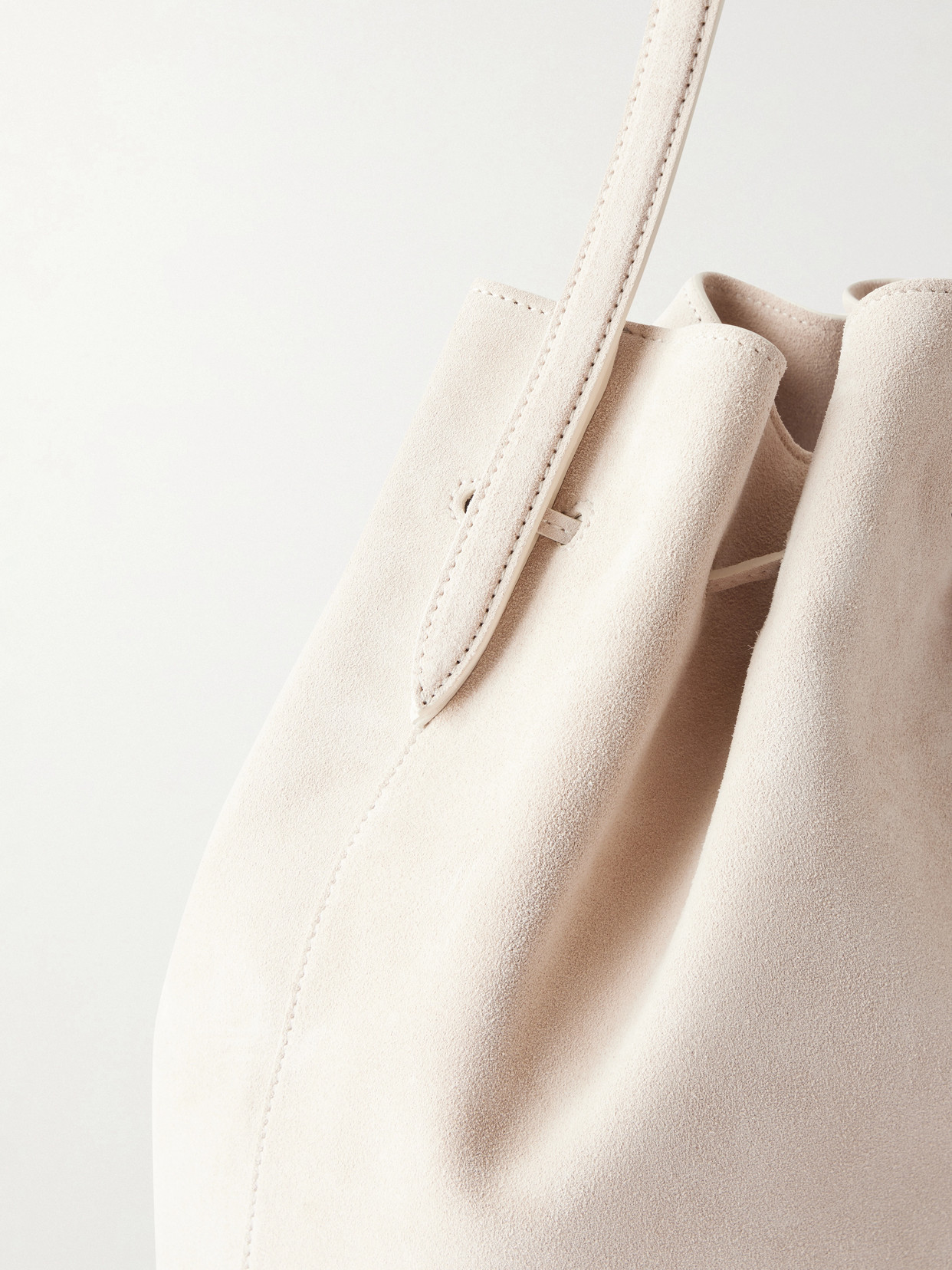 Liffner Charm Suede Drawstring Shoulder Bag In Neutral