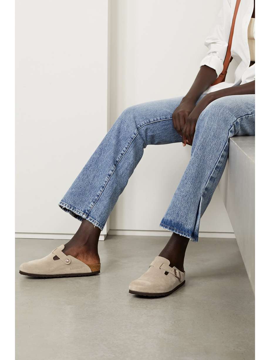 Debuted in 1977, Birkenstock's iconic 'Boston' slippers are still so highly regarded for their comfort and ease. This pair has been made in Germany from suede and set on ergonomic cork soles designed to mold to your feet over time. They also have the brand's signature buckled strap at the side.