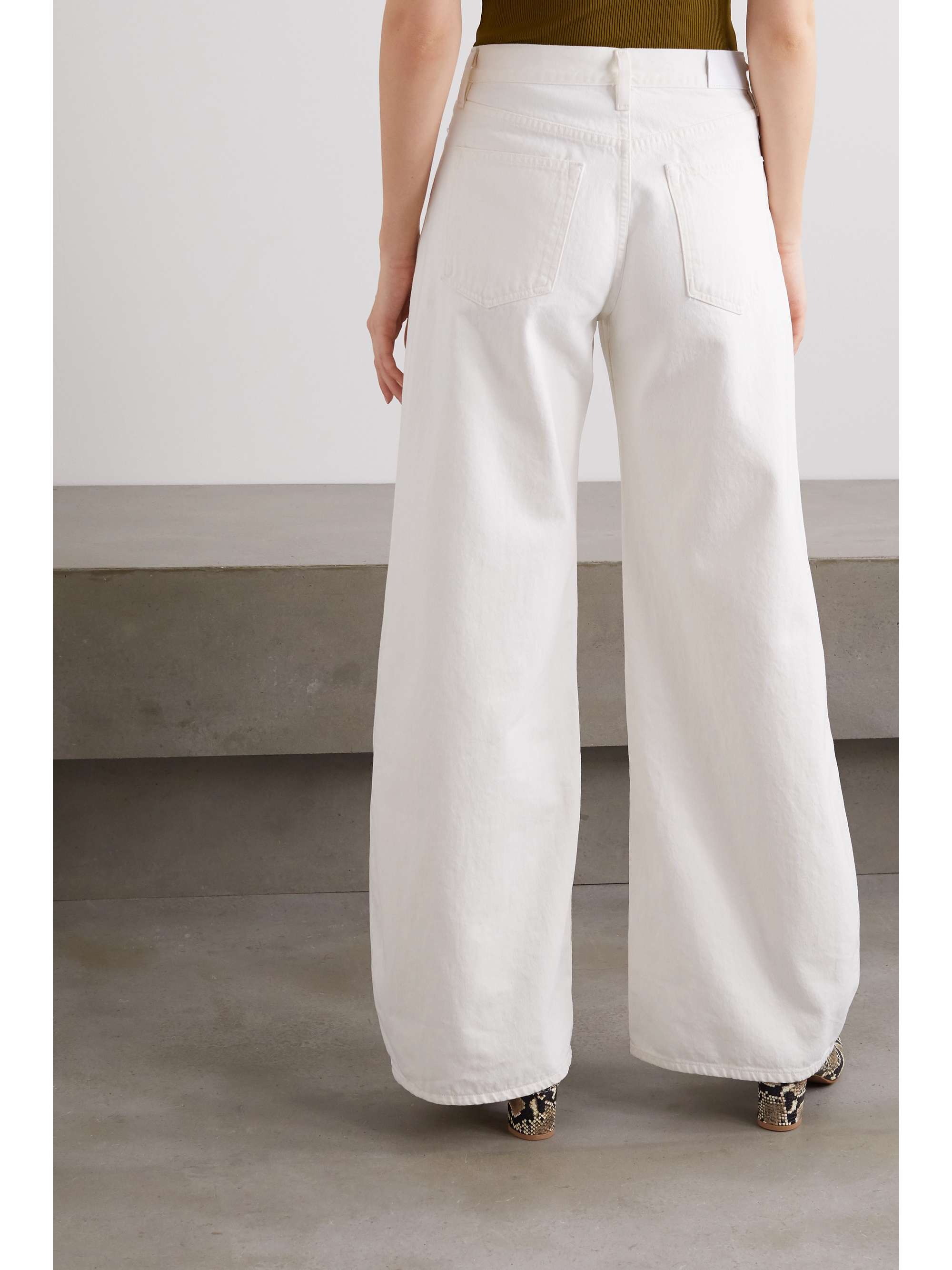 GOLDSIGN + NET SUSTAIN pleated high-rise wide-leg jeans