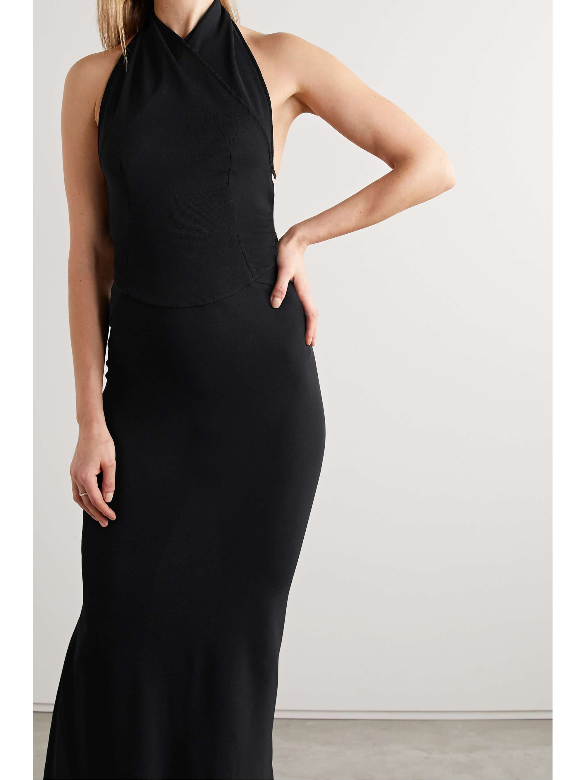 ALAÏA Open-back wrap-effect stretch-knit halterneck gown