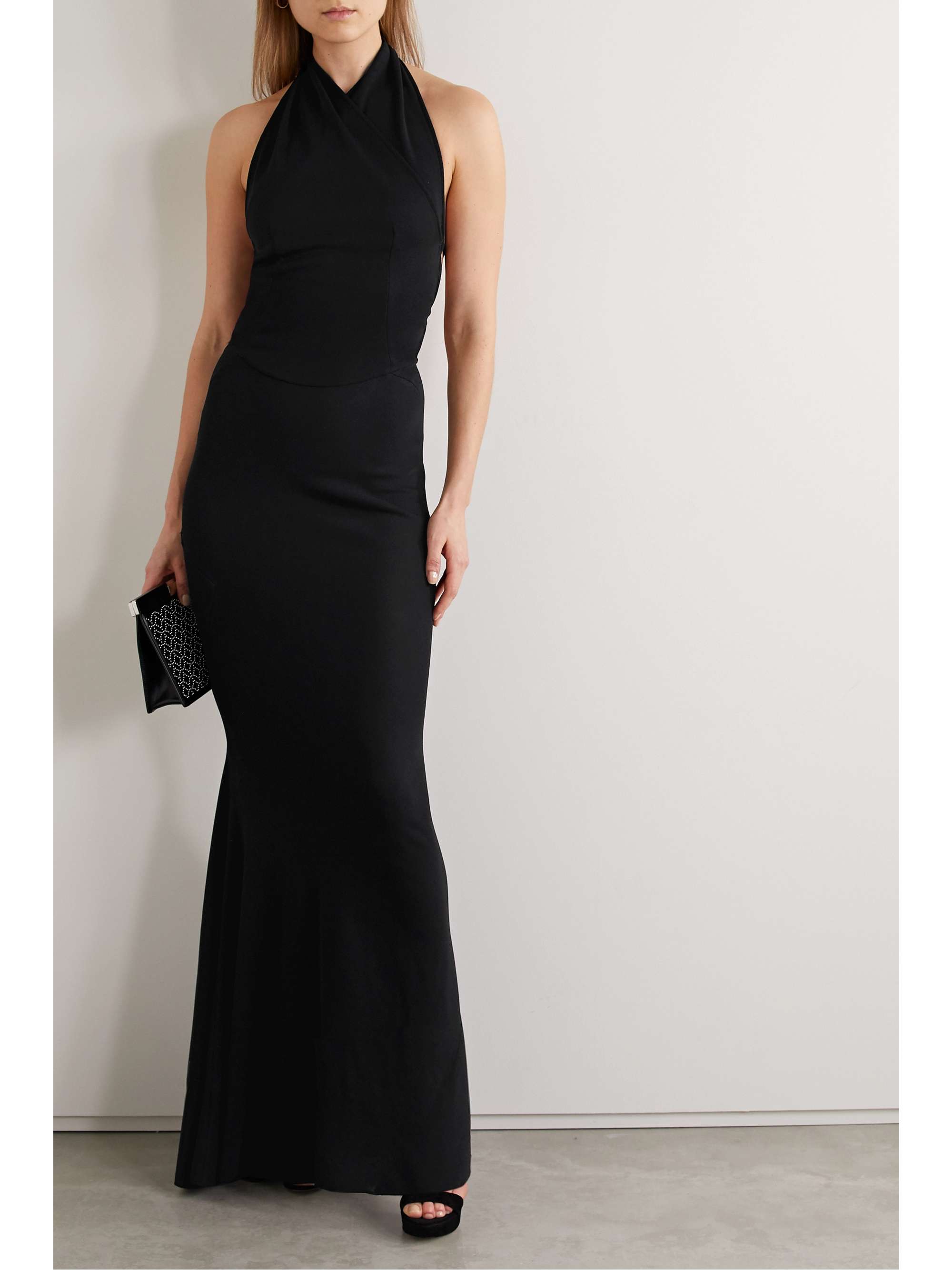 ALAÏA Open-back wrap-effect stretch-knit halterneck gown