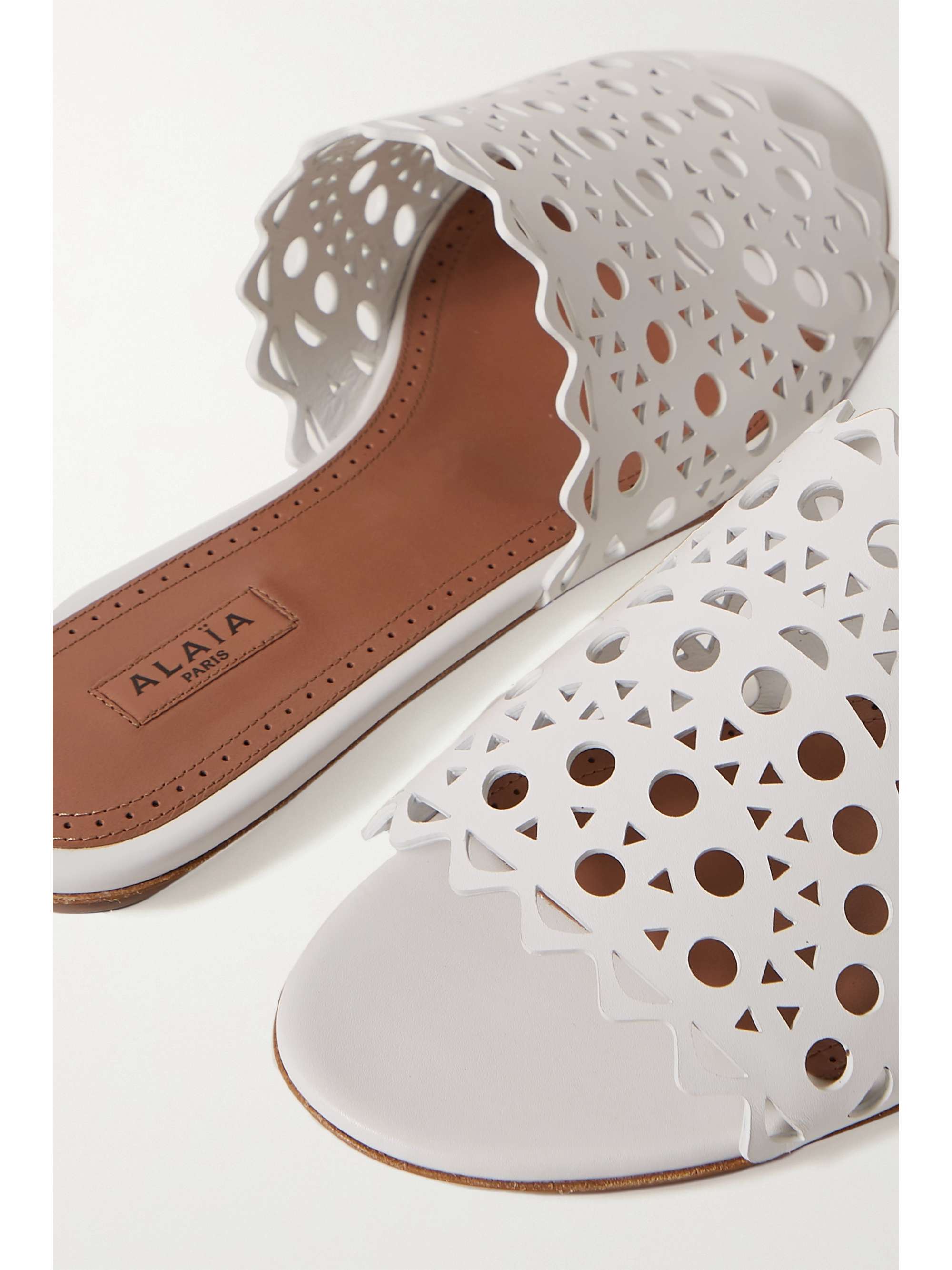White Laser-cut leather slides | ALAÃA | NET-A-PORTER